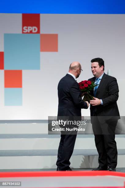 Martin Schulz and Hubertus Heil are pcitured during the party congress of the German Social Democratic Party in Berlin, Germany on December 7, 2017.