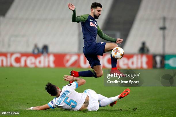 Munas Dabbur of Salzburg and Lucas Ocampos of Marseille during the Uefa Europa League match between Olympique de Marseille and Red Bull Salzburg at...