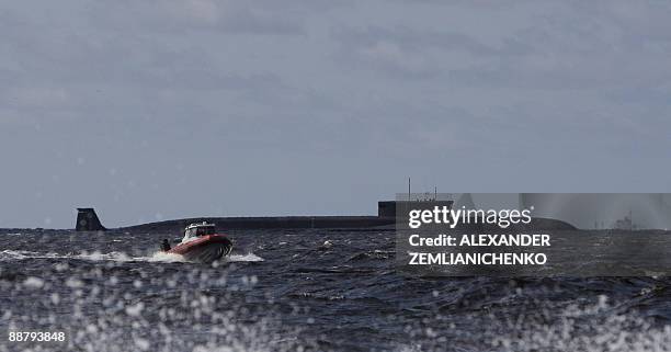 New Russian nuclear submarine, the Yuri Dolgoruky, drives in the water area of the Sevmash factory in the northern city of Arkhangelsk on July 2,...