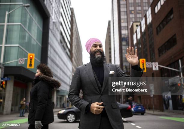 Jagmeet Singh, leader of the New Democratic Party , waves to a pedestrian while standing for a photograph in Ottawa, Ontario, Canada, on Thursday,...