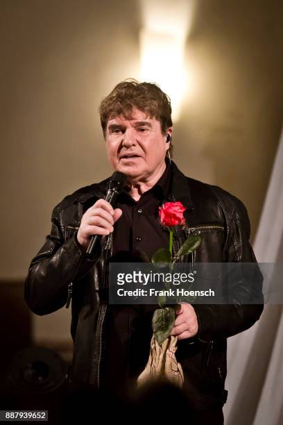 German singer Frank Schoebel performs live on stage during a concert at the Gethsemanekirche on December 7, 2017 in Berlin, Germany.