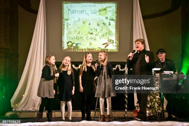 German singer Frank Schoebel performs live on stage during a concert at the Gethsemanekirche on December 7, 2017 in Berlin, Germany.