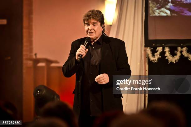 German singer Frank Schoebel performs live on stage during a concert at the Gethsemanekirche on December 7, 2017 in Berlin, Germany.