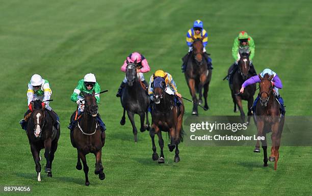 Jockey Jack Dean riding Epsom Salts beats Paul Doe riding Watson's Bay to win the Office Depot Handicap Stakes at Epsom Downs Race Course on July 2,...