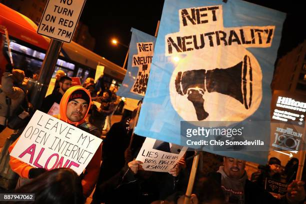 About 60 demonstrators gather outside of the 31st Annual Chairman's Dinner to show their support for net neutrality at the Washington Hilton December...