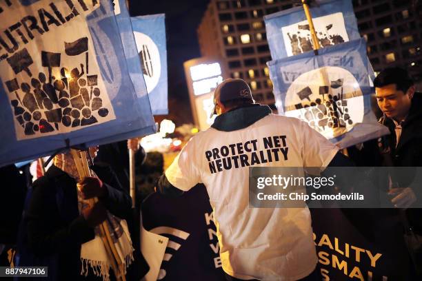 About 60 demonstrators gather outside of the 31st Annual Chairman's Dinner to show their support for net neutrality at the Washington Hilton December...