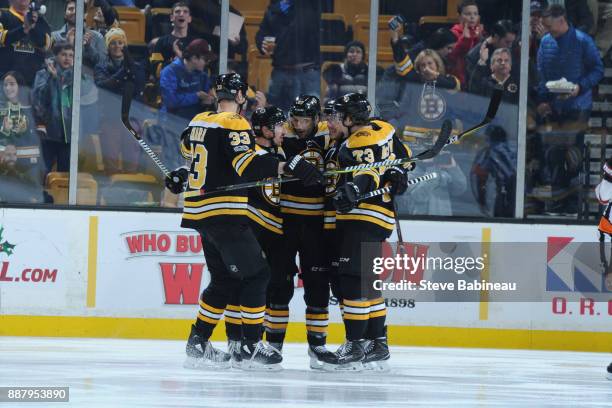Zdeno Chara, Brad Marchand, Patrice Bergeron, David Pastrnak and Charlie McAvoy of the Boston Bruins celebrate a goal 15 seconds into the first...