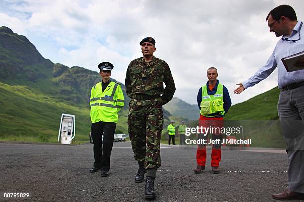 Squadron leader Paul Lipscombe briefs the gathered media at a police road block on the A83 in Argyll near to where an RAF Tornado has crashed on July...