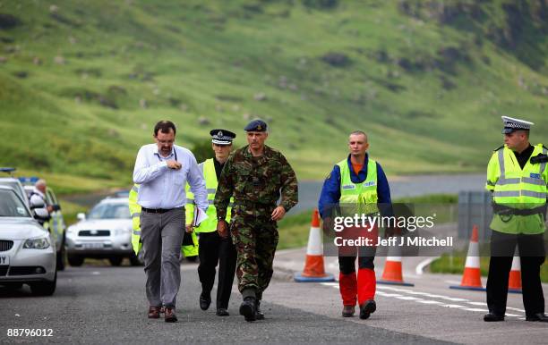 Squadron leader Paul Lipscombe prepares to brief gathered media at a police road block on the A83 in Argyll near to where an RAF Tornado has crashed...