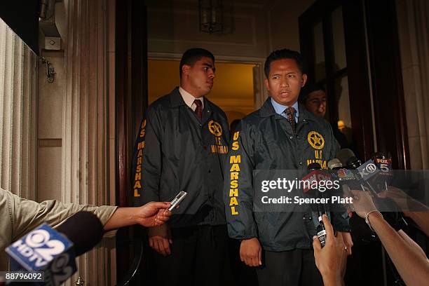 United States marshals exit the building where former financier Bernard Madoff and his wife Ruth owned an apartment on July 2, 2009 in New York City....