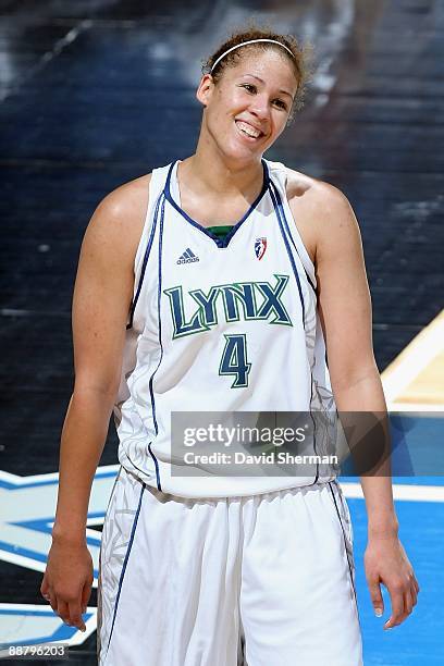 Christi Thomas of the Minnesota Lynx smiles on the court during the WNBA game against the Phoenix Mercury on June 27, 2009 at Target Center in...