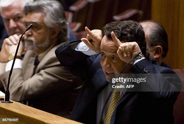 Portugal Minister of Economics Manuel Pinho gestures during the state of the nation debate in the parliament in Lisbon on July 2, 2009. After the...