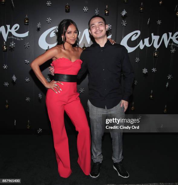 Actress & Model Karrueche Tran poses with her brother Raymond Adamson as she hosts the Curve Fragrances Holiday Party at Arlo NoMad on December 7,...