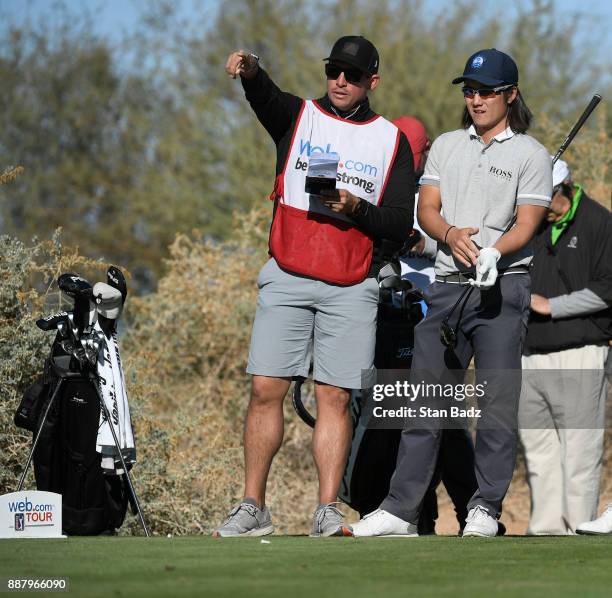 Player Scott Stallings caddies for Richard H. Lee on the ninth hole during the first round of the Web.com Tour Qualifying Tournament at Whirlwind...