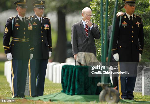 Secretary of the Army Pete Geren stansds during the burial ceremony for U.S. Army Private Kelly Youngblood on what would have been his 22nd birthday...