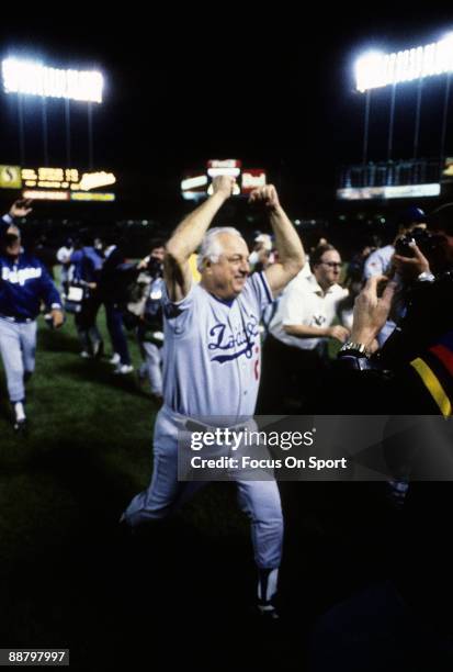 Los Angeles Dodgers Manager Tommy Lasorda runs off the field with his fist in the air after the Dodger beat the Oakland Athletics in game 5 of the...