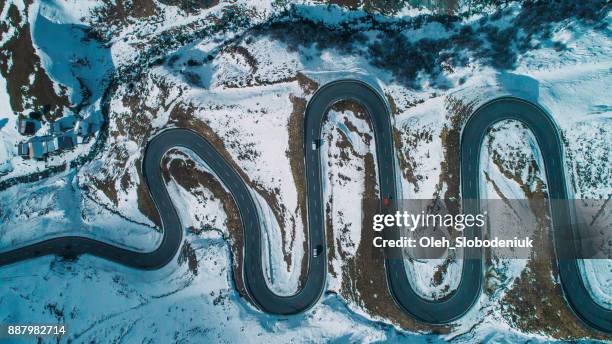 aerial view of red car on  julier pass in switzerland - aerial mountain pass imagens e fotografias de stock