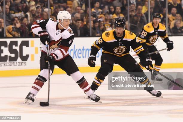 Jakob Chychrun of the Arizona Coyotes skates against David Backes of the Boston Bruins at the TD Garden on December 7, 2017 in Boston, Massachusetts.