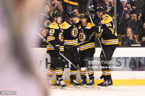 Danton Heinen, David Backes, Riley Nash and Zdeno Chara of the Boston Bruins celebrate a goal in the second period against the Arizona Coyotes at the...