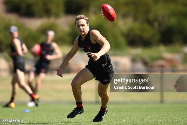 Dylan Clarke runs with the ball during an Essendon Bombers Media Announcement & Training Session at Essendon Football Club on December 8, 2017 in...