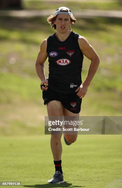 Kobe Mutch runs during an Essendon Bombers Media Announcement & Training Session at Essendon Football Club on December 8, 2017 in Melbourne,...