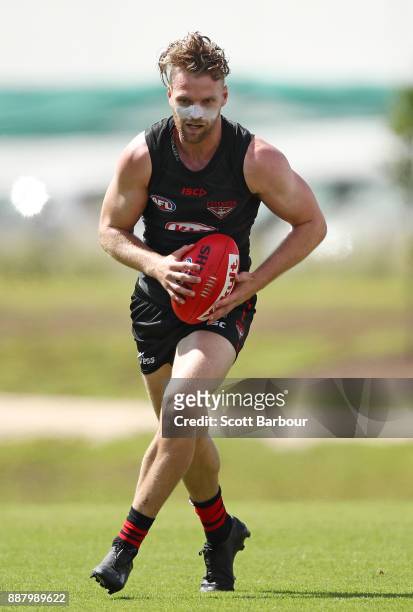 Jake Stringer of the Bombers runs with the ball during an Essendon Bombers Media Announcement & Training Session at Essendon Football Club on...