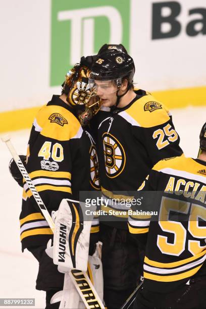 Tuukka Rask and Brandon Carlo of the Boston Bruins celebrate a win against the Arizona Coyotes at the TD Garden on December 7, 2017 in Boston,...