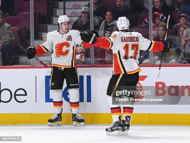 Sean Monahan of the Calgary Flames celebrates after scoring the winning goal against the Montreal Canadiens in the NHL game at the Bell Centre on...