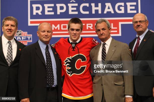 Calgary Flames Director of Scouting Tod Button, Scout Al Tuer, draft pick Tim Erixon, General Manager Darryl Sutter and President & CEO Ken King pose...