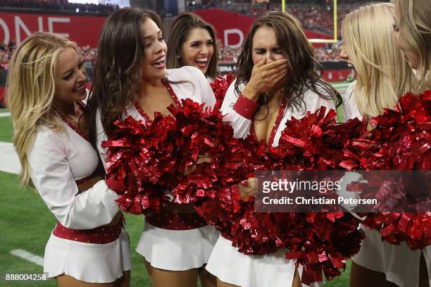 Arizona Cardinals cheerleader, Nikki reacts after being named to the pro bowl game during the NFL game against the Los Angeles Rams at the University...