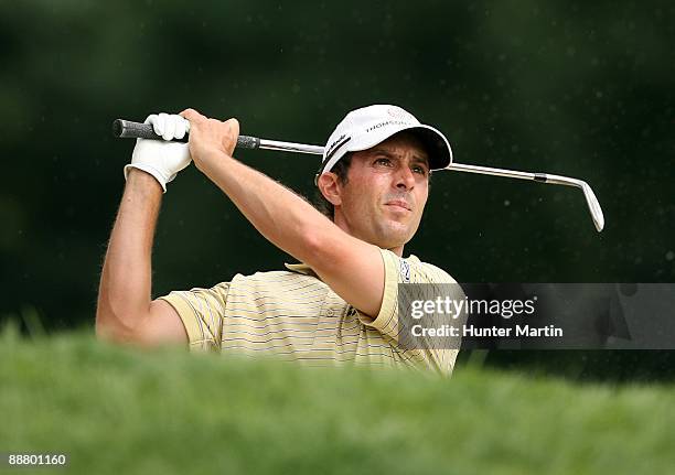 Mike Weir of Canada hits his second shot on the eighth hole during the first round of the AT&T National hosted by Tiger Woods at Congressional...