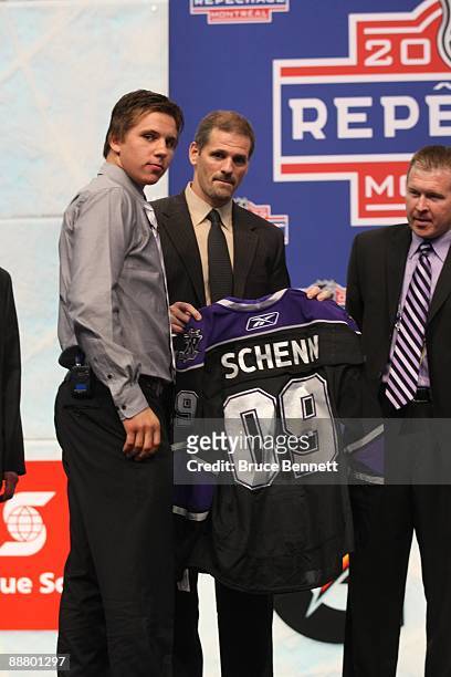 Brayden Schenn joins Los Angeles Kings VP/Assistant GM Ron Hextall and Co-Director of Amateur Scouting Michael Futa on stage after being drafted...