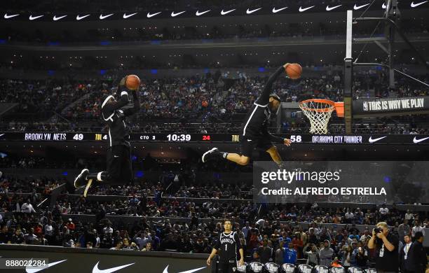 Players perform at halftime in the NBA game between the Oklahoma City Thunder and Brooklyn Nets on December 7 in Mexico City. / AFP PHOTO / ALFREDO...