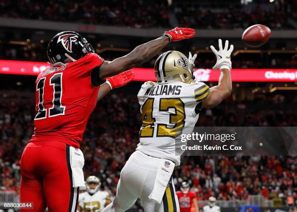 Marcus Williams of the New Orleans Saints intercepts this touchdown reception intended for Julio Jones of the Atlanta Falcons at Mercedes-Benz...