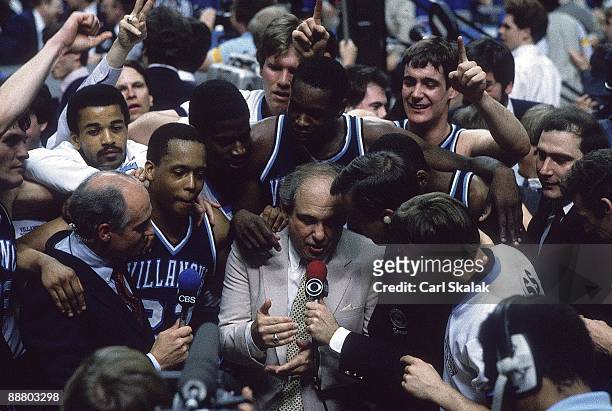 Final Four: Villanova coach Rollie Massimino victorious with team during media interview with CBS Sports after winning game vs Georgetown. Lexington,...