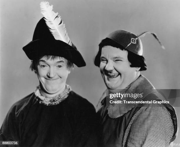 Comedy duo Stan Laurel , left, and Oliver Hardy pose in costume for a publicity photo in Hollywood, 1930.