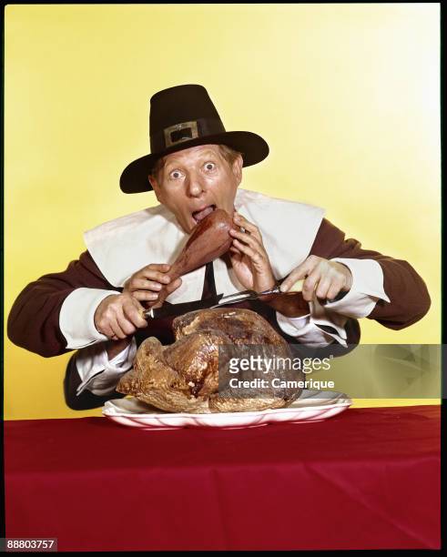 The actor and comedian Danny Kaye acts out a Thanksgiving comedy scene while dressed as an American pilgrim, ca. 1965. His character has multiple...