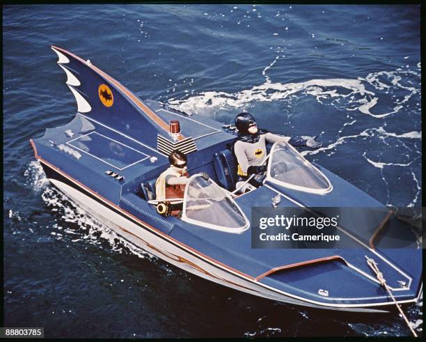 Adam West and Burt Ward as Batman and Robin riding the Bat Boat, from the television series "Batman", 1966.