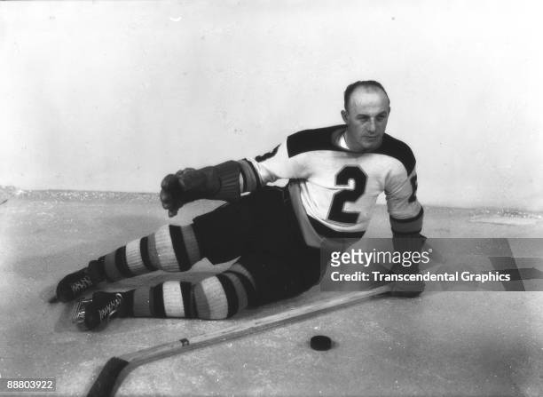 Famous Boston Bruins star Eddie Shore poses for a photo on the ice in Boston Garden around 1930.