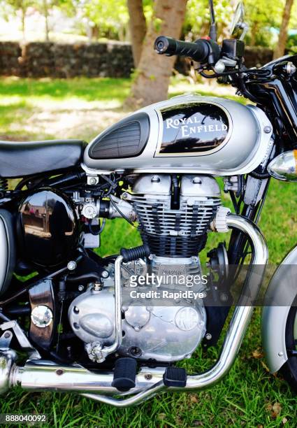 cropped side-view of royal enfield classic 500 motorcycle - indian royal enfield stock pictures, royalty-free photos & images