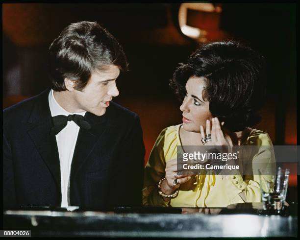 Warren Beatty and Elizabeth Taylor play opposite each other in a scene from the movie "The Only Game In Town", 1970.