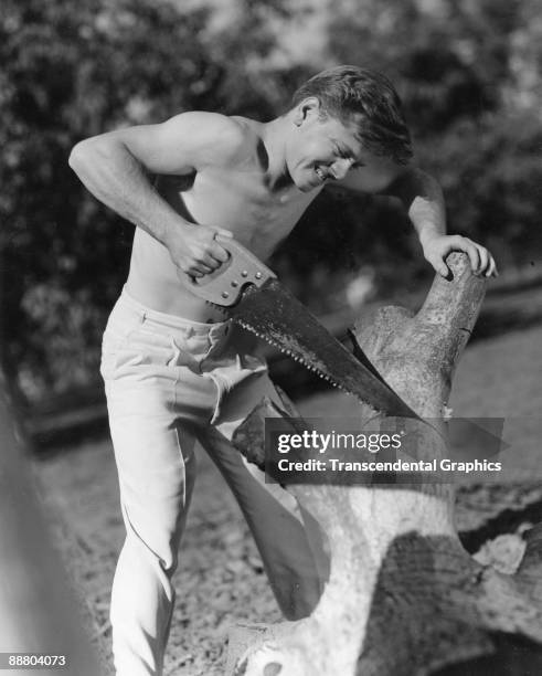 Mickey Rooney poses for an action close up during a publicity shoot in Hollywood, ca.1930.