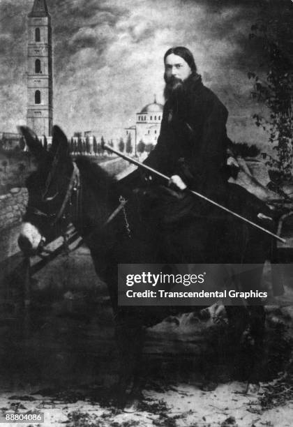 Russian mystic Grigori Rasputin poses on a donkey in a Russian photo studio in Moscow around 1910.