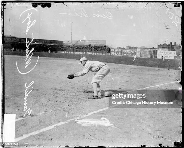 Informal full-length portrait of baseball player Chick Gandil of the American League's Chicago White Sox, holding his hands in front of him and...