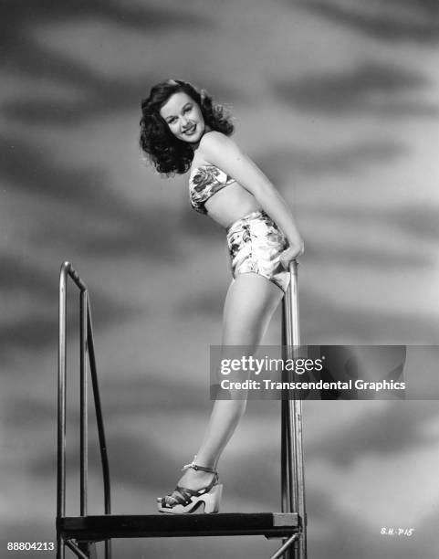 Susan Hayward poses in a swimsuit during a publicity shoot in Hollywood, CA, ca.1940s.