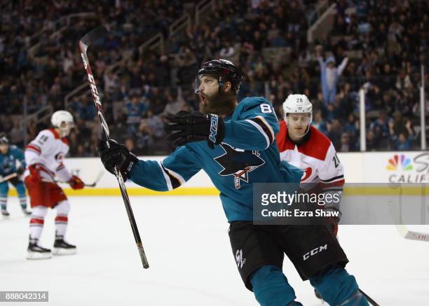 Brent Burns of the San Jose Sharks celebrates after he scored the game-winning goal on Cam Ward of the Carolina Hurricanes in overtime at SAP Center...