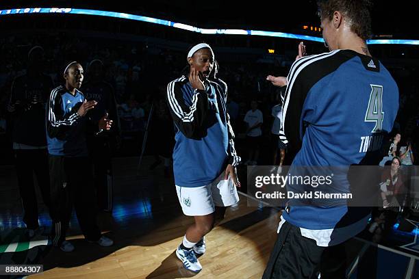 Charde Houston of the Minnesota Lynx gets cheered on by teammates during introductions before the game against the Sacramento Monarchs on July 2,...
