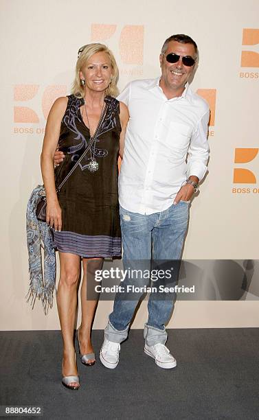 Host Sabine Christiansen and husband Norbert Medus attend the 'BOSS Orange' fashion party during the Mercedes-Benz Fashion Week Berlin S/S 2010 at...