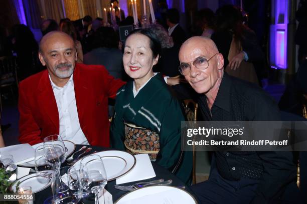 Christian Louboutin, Setsuko Klossowska de Rola and Pierre Commoy of "Pierre et Gilles" attend the Annual Charity Dinner hosted by the AEM...