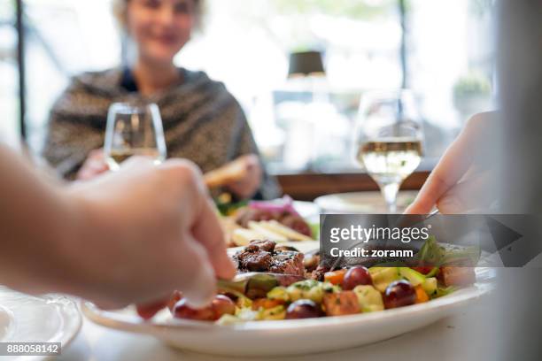personal point of view of woman cutting steak - roast beef stock pictures, royalty-free photos & images